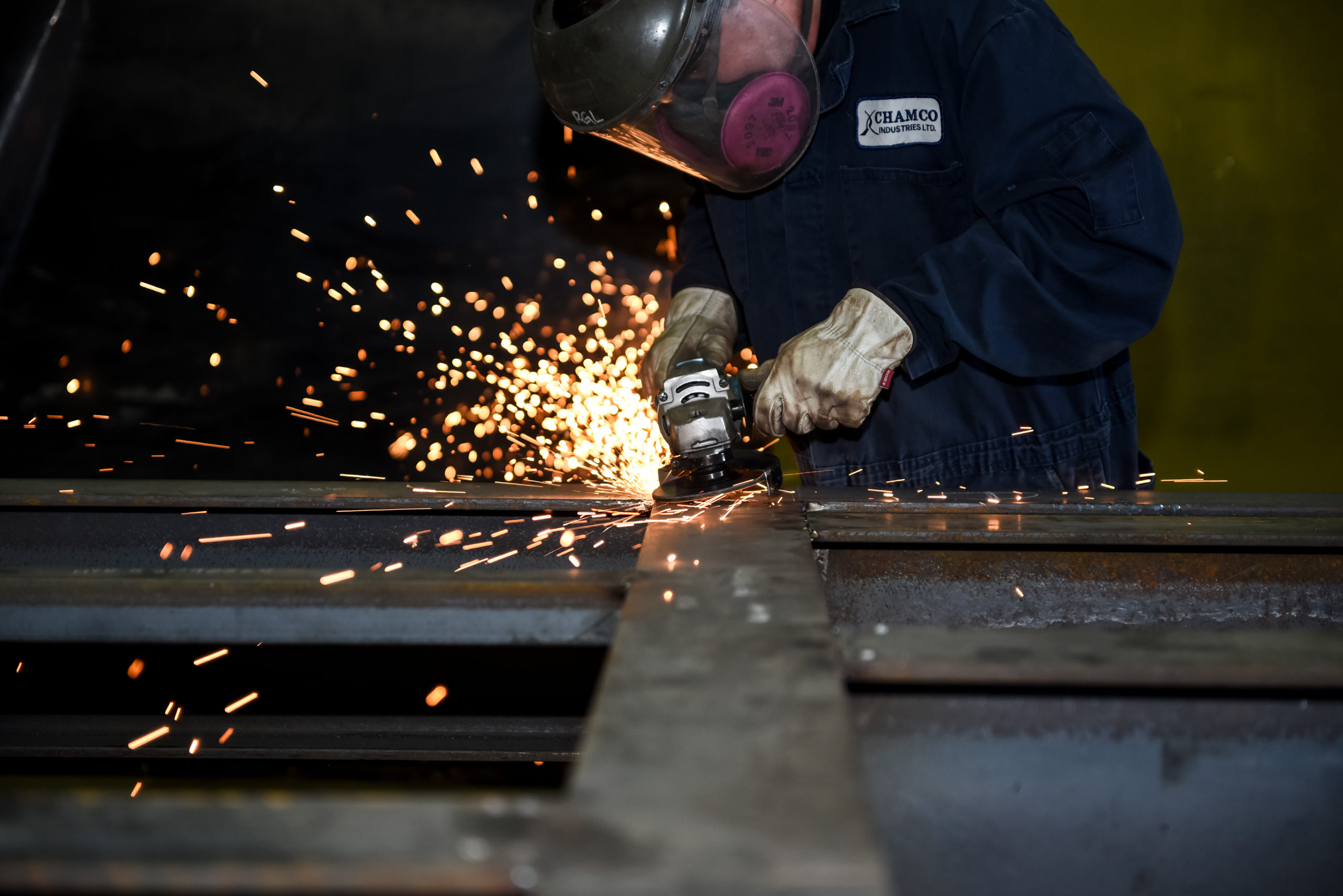 technician fabricating engineered air compressor system